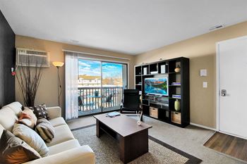 Carlyle place apartments living room with access to private balcony