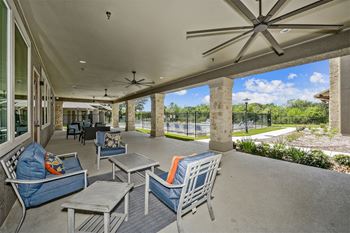 champions gate apartments shaded outdoor lounge area with ceiling fans