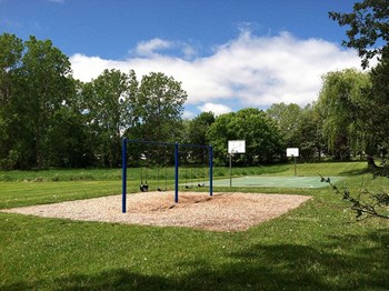 coolidge place townhomes swings and basketball court - Photo Gallery 22