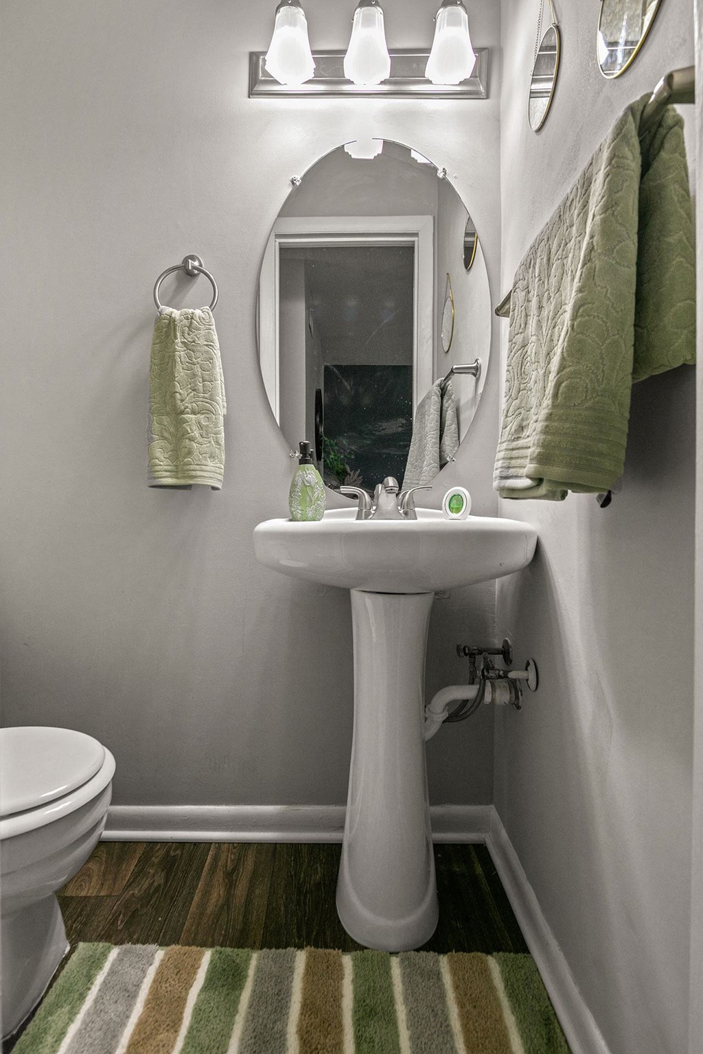a small bathroom with a sink and a mirror