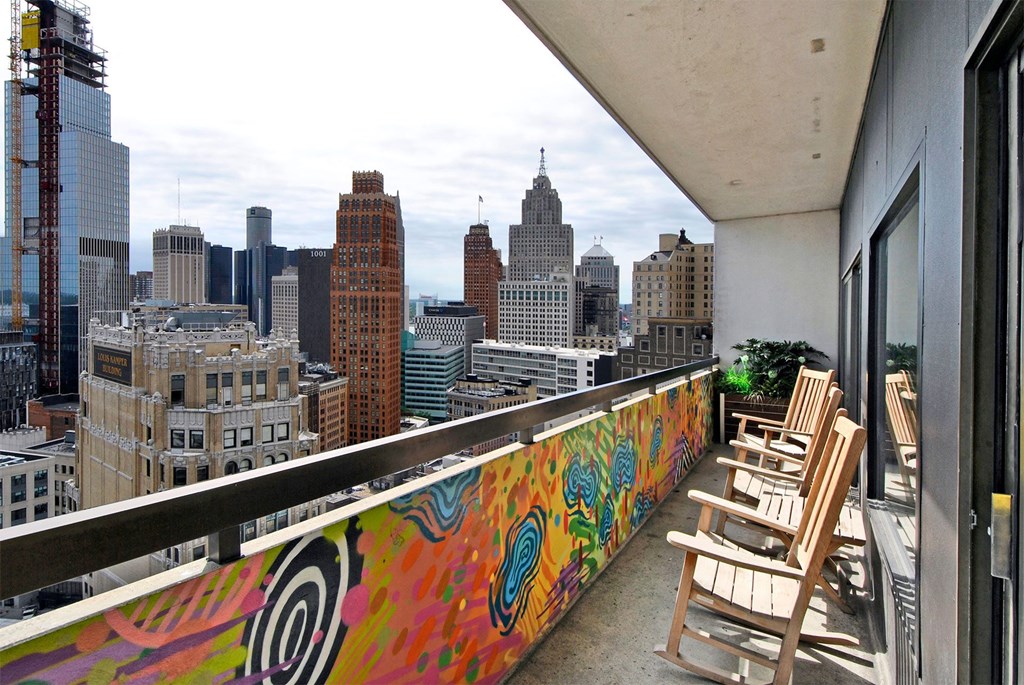 a view of the city from the balcony of a apartment