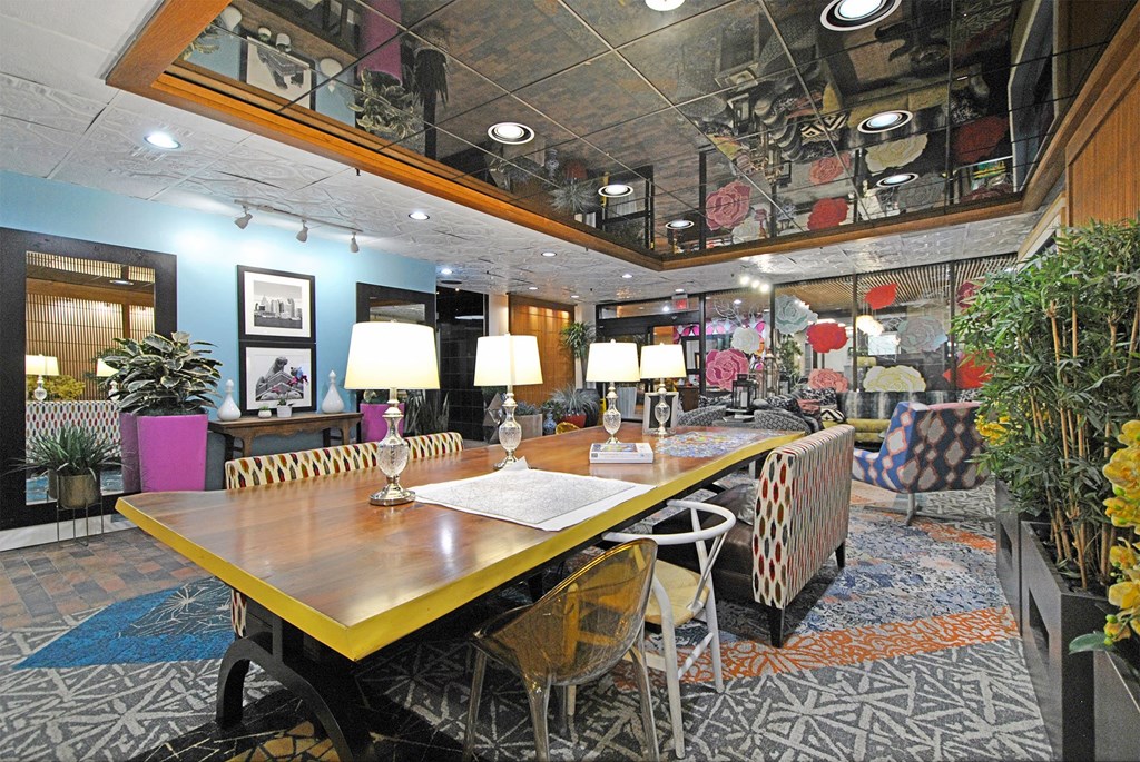a dining room with a long table and chairs