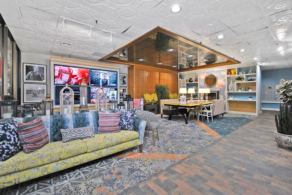 a living room with a couch and a ping pong table