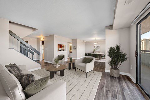 A living room with a white couch and a coffee table.