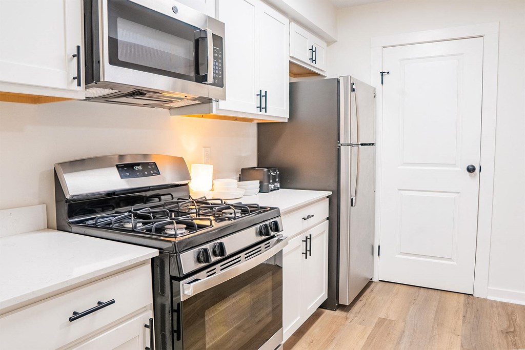 kitchen with white cabinetry and stainless steel appliances