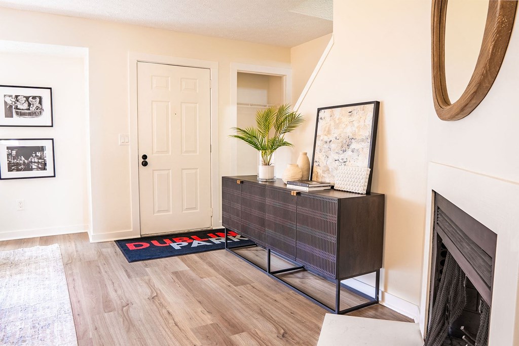 townhome front door with credenza and stairway