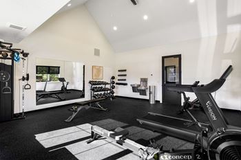 fitness center with treadmills and other exercise equipment
