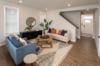 a living room with a couch and a table