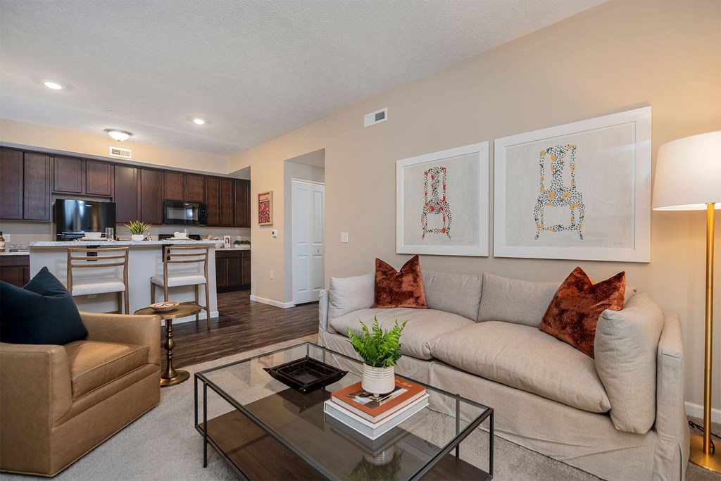 A living room with a couch, chair, and coffee table.