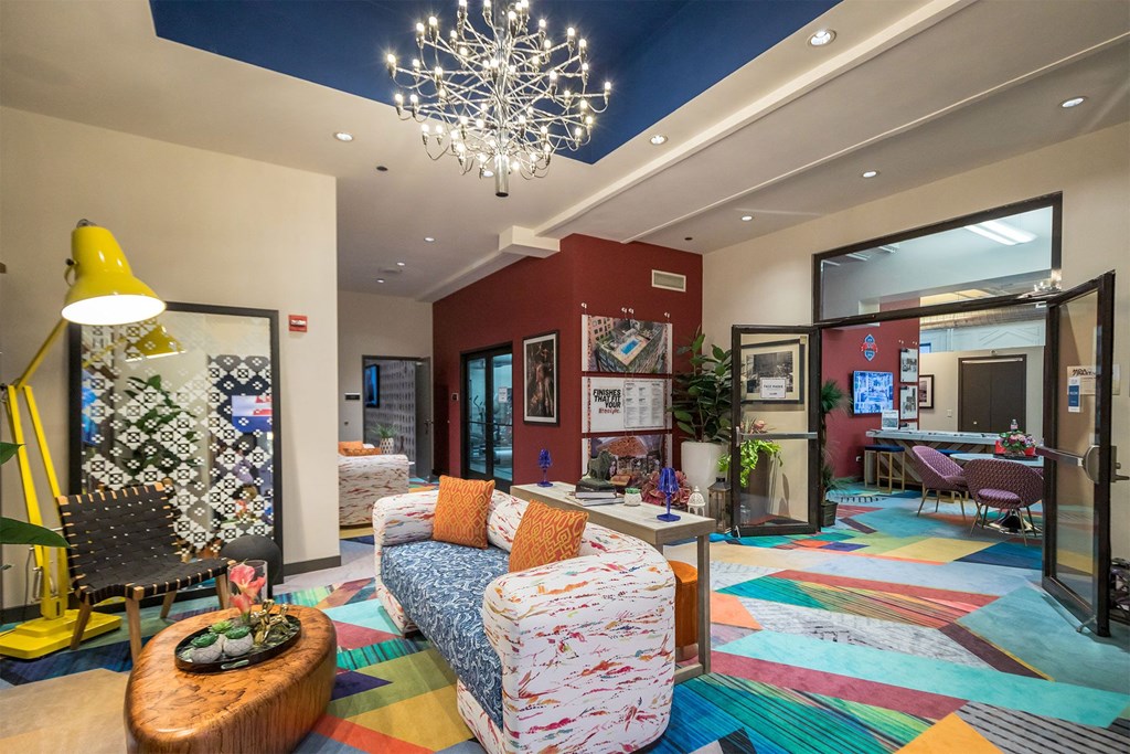 a living room with couches and chairs and a fireplace