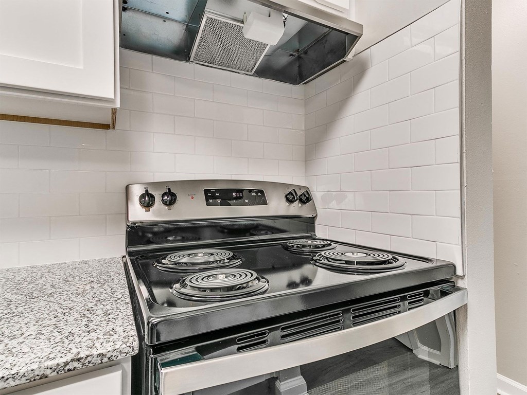 a kitchen with a stove and a counter top