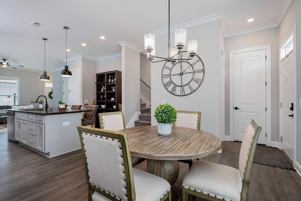 a dining room with a table and chairs