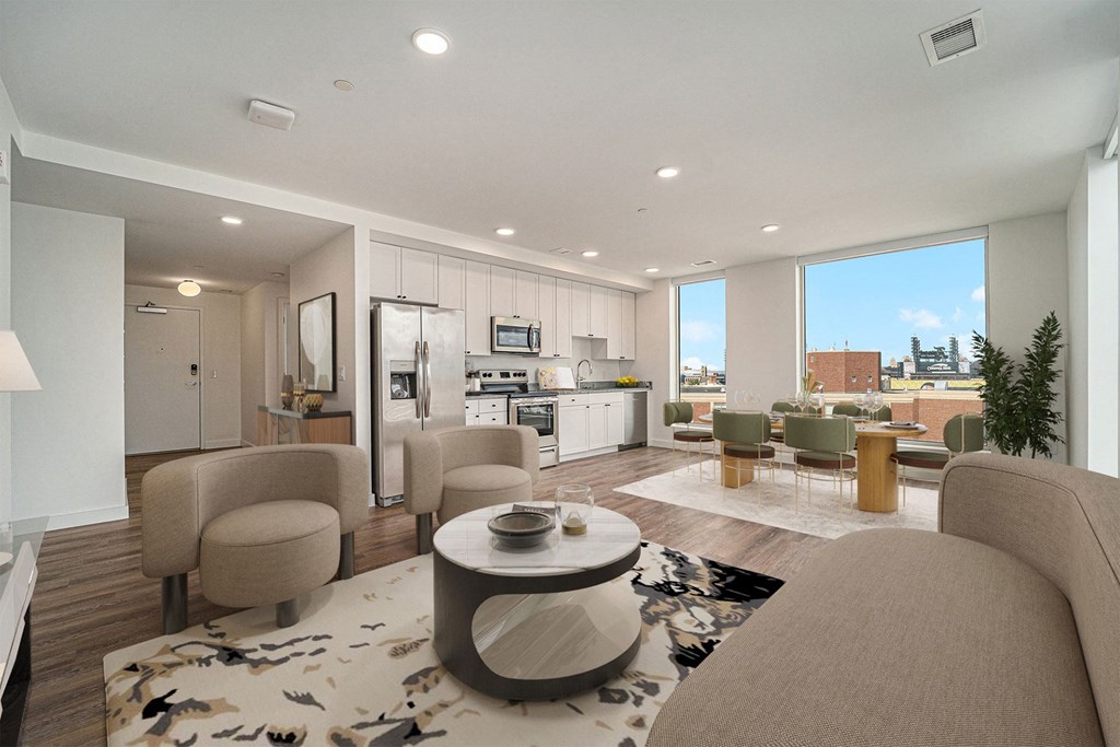 a living room with couches and chairs and a table