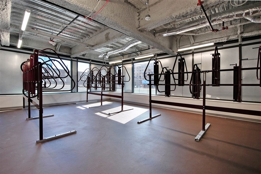 a room full of exercise equipment in a building