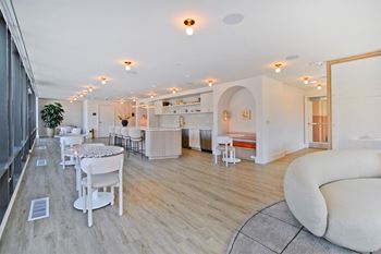 a living room with a dining room and a kitchen
