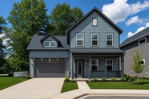 A two-story house with a garage on the first floor.