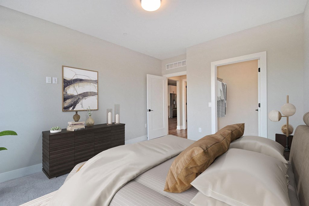 a bedroom with a large bed and a closet