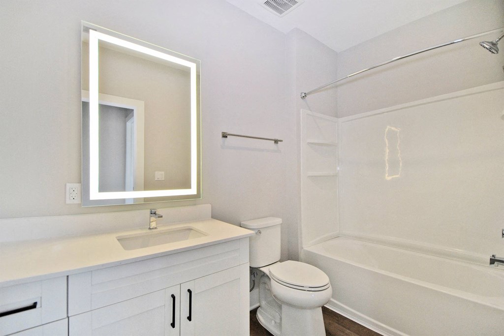 a bathroom with a sink toilet and a shower