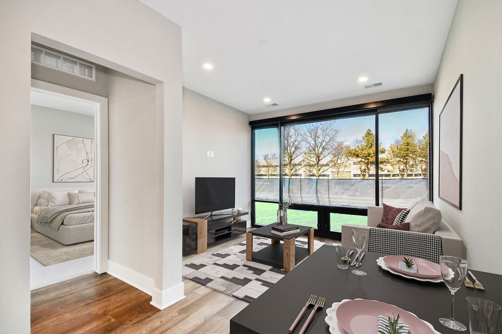 a living room with a couch and a table and a tv