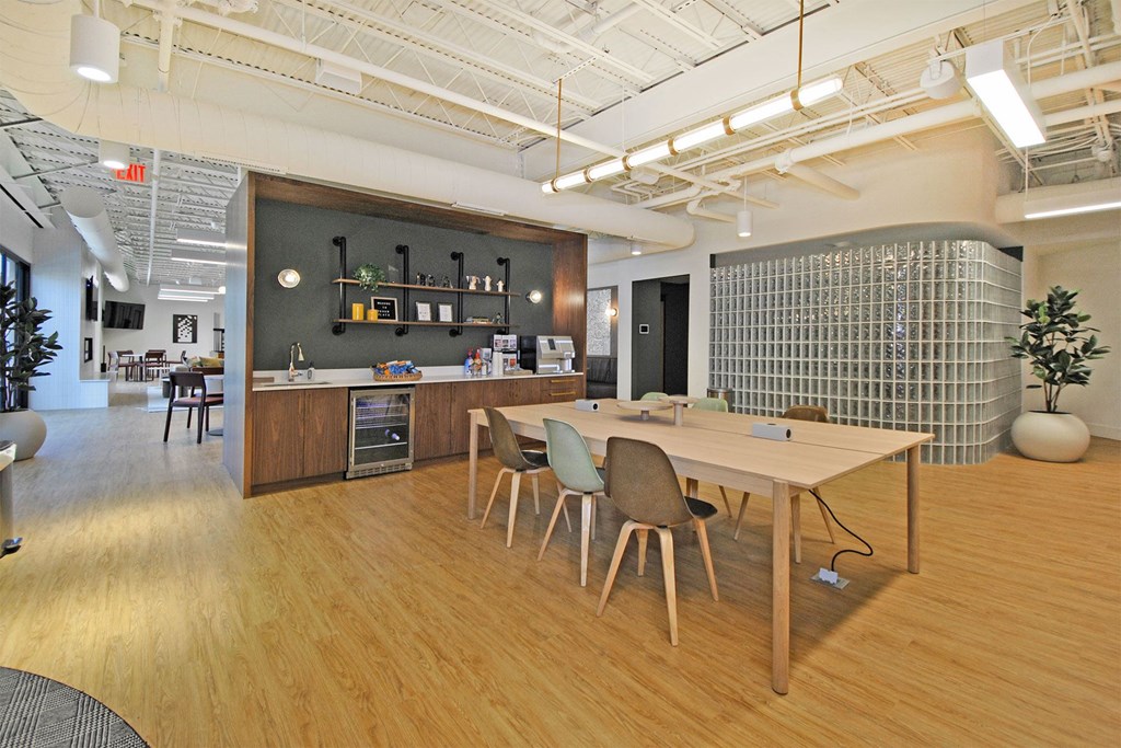 a dining room with a table and chairs