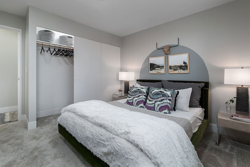 a bedroom with a bed and a closet