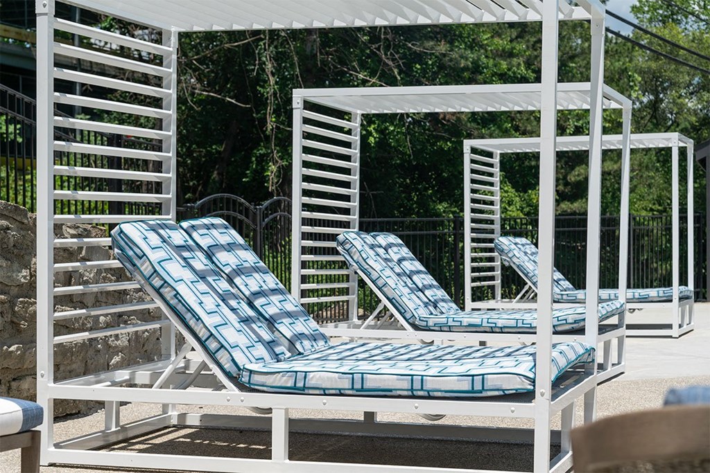 a group of lounge chairs on a patio