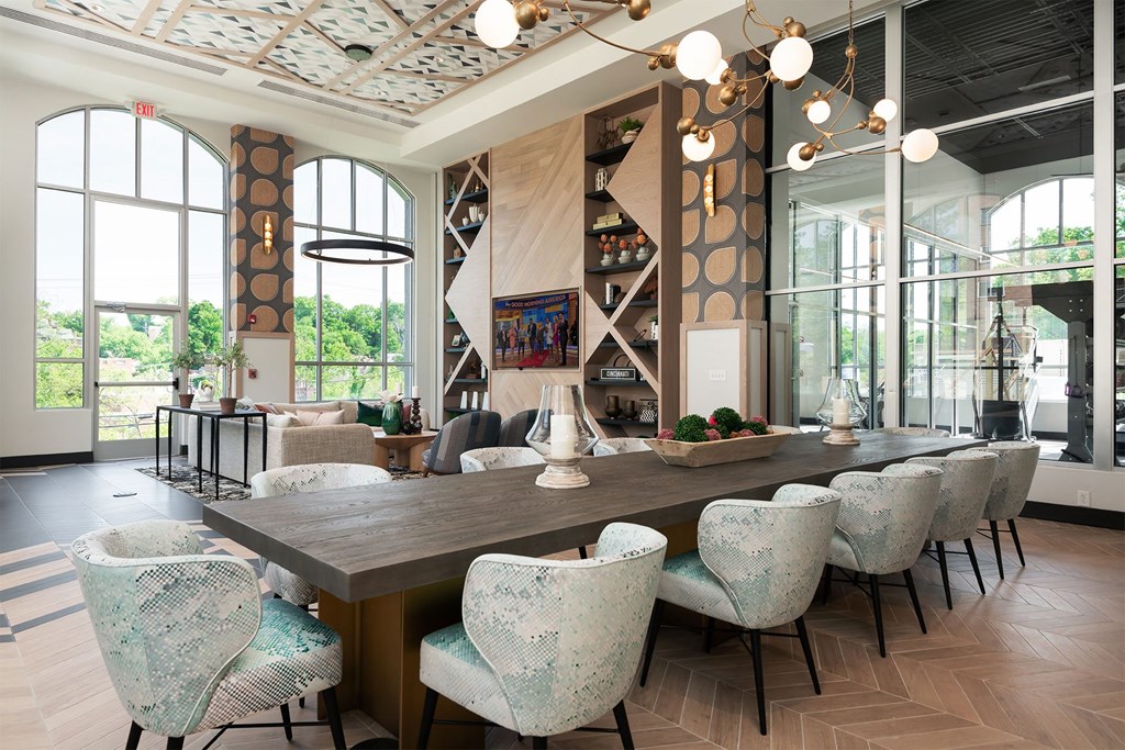 a large dining room with a long table and chairs