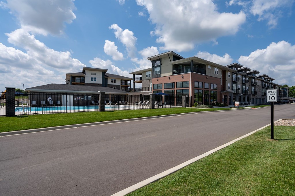A modern building with a pool in front.