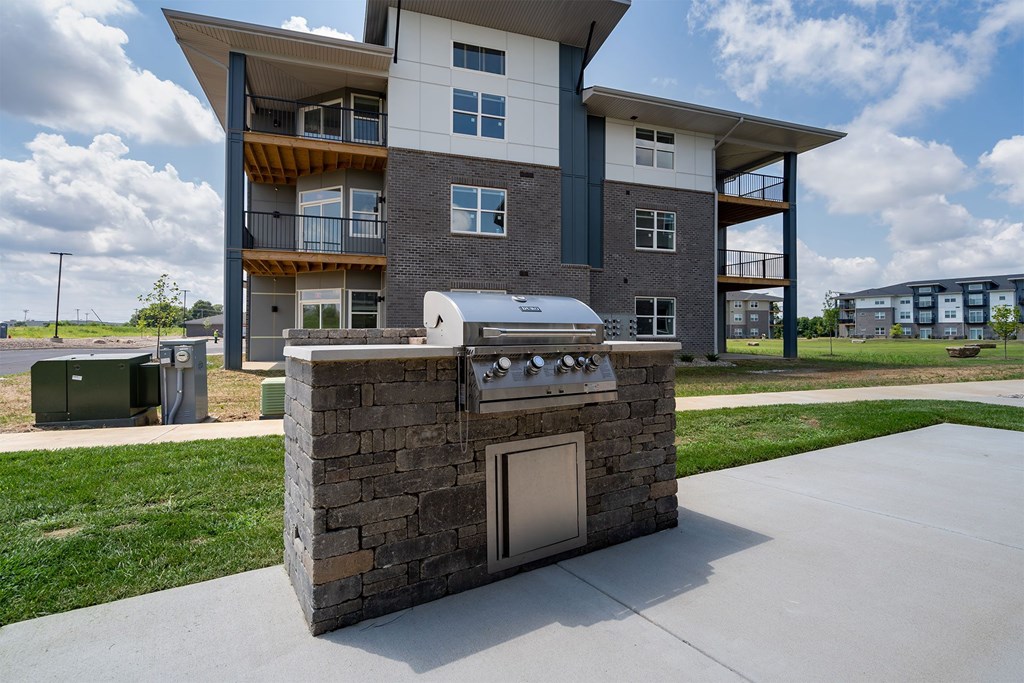 A modern house with a stone pillar in front of it.