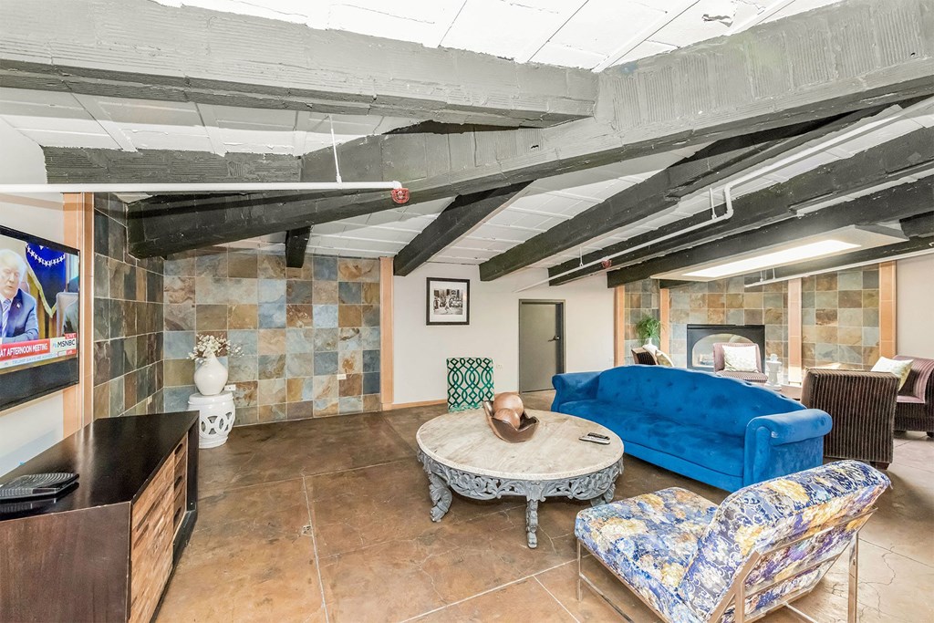 a living room with a blue couch and a table
