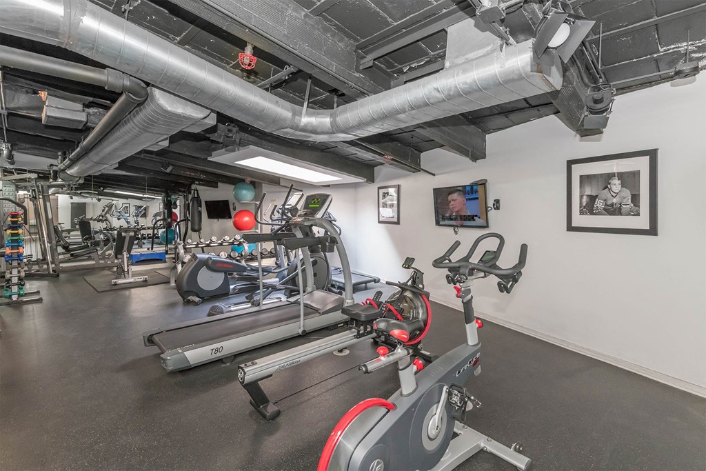 the gym at the district at highland village apartments