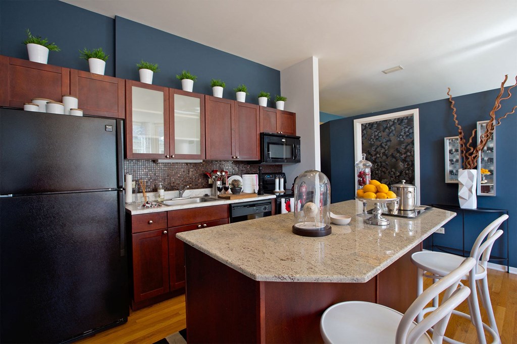 a kitchen with a counter top and a refrigerator
