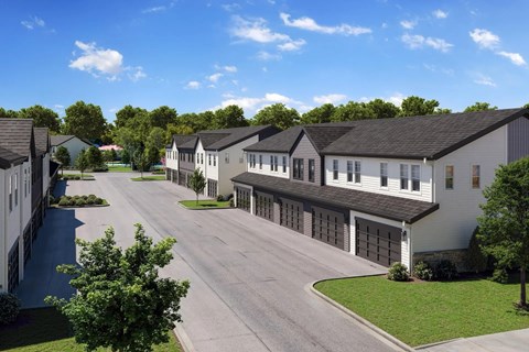 A street view of a residential area with houses on both sides.