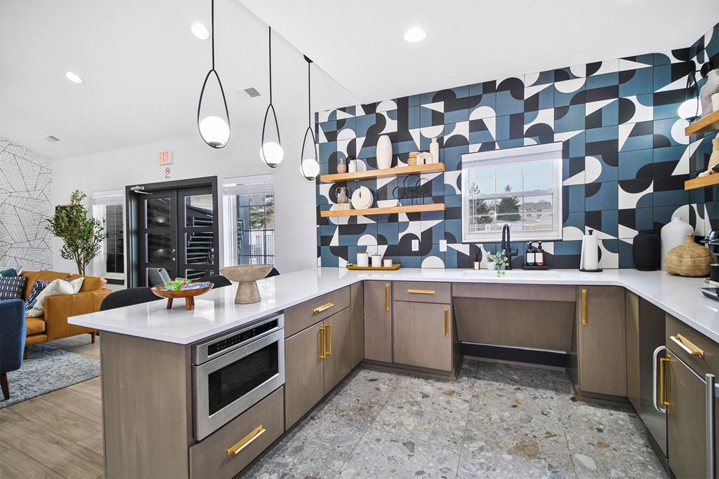 A modern kitchen with a large island and wooden cabinets.