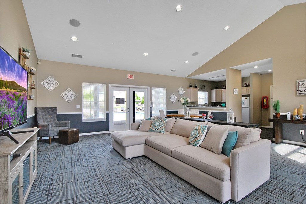 A living room with a couch and a chair.