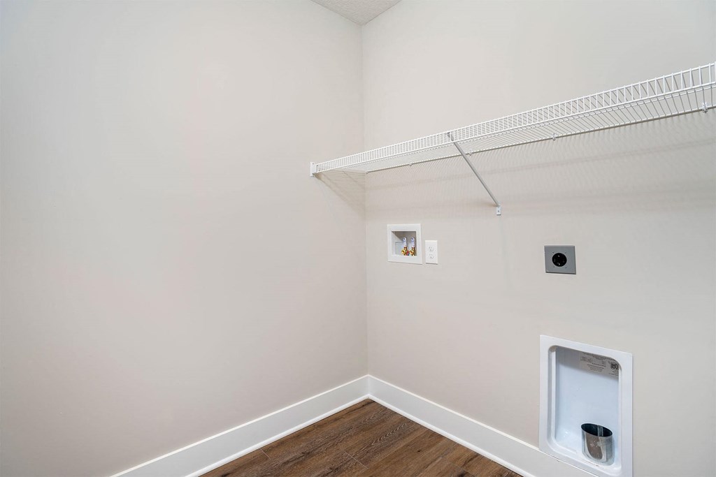a white room with a closet and a toilet in it