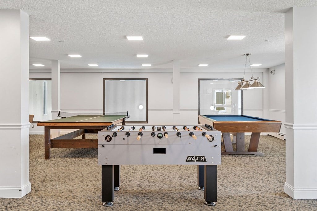 A pool table with a green felt cloth and a white background.