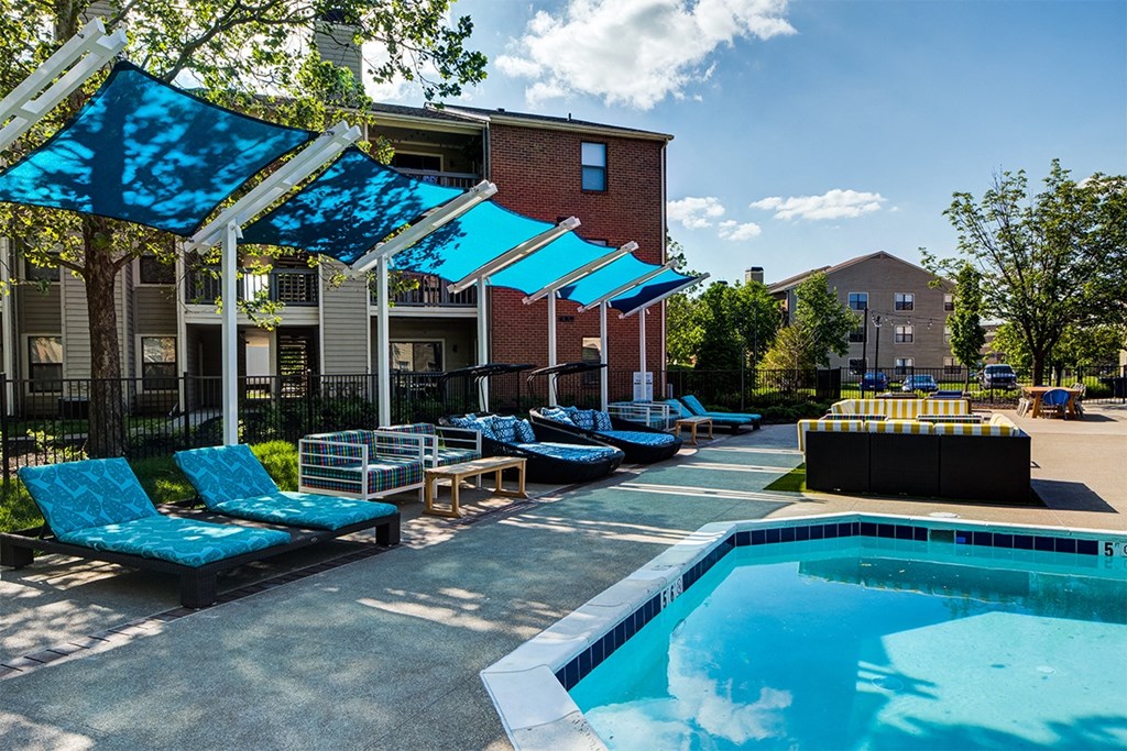 our apartments have a resort style pool with lounge chairs and umbrellas