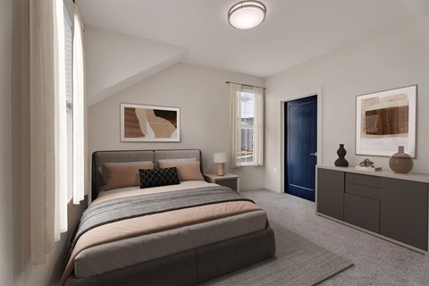 A bedroom with a large bed and a blue door.