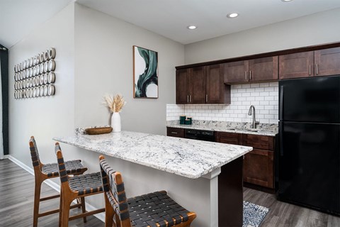 a kitchen with a marble counter top