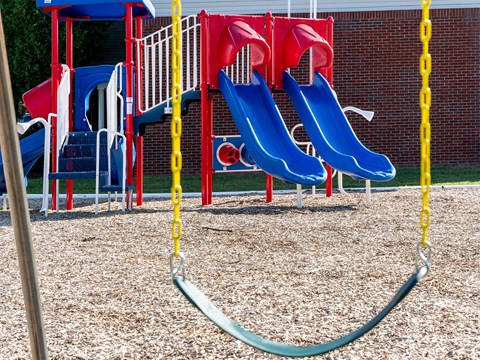 a group of slides at a playground
