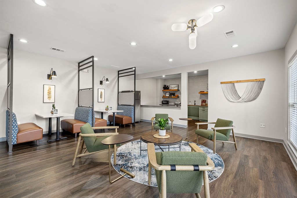 A modern dining room with a round table and chairs.