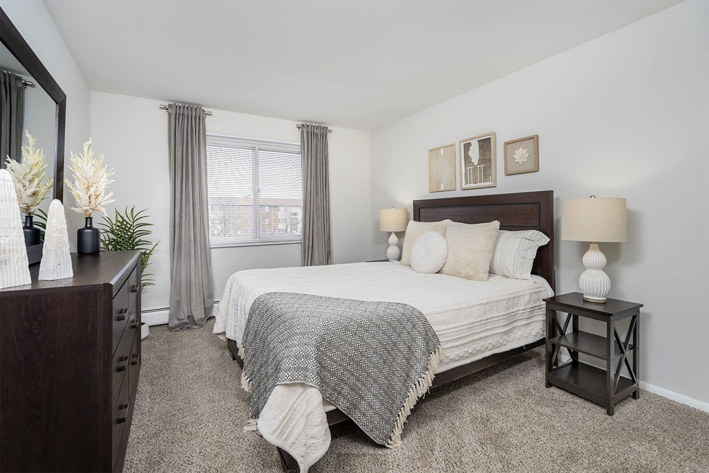 bright naturally lit bedroom with queen size bed