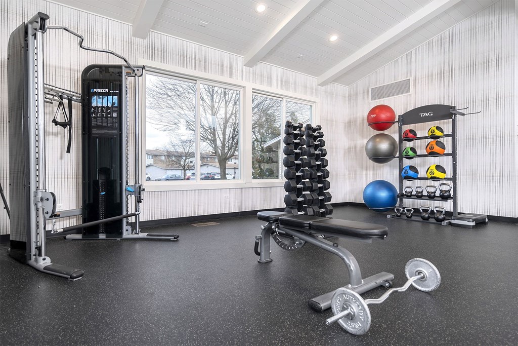 fitness center with weight lifting equipment