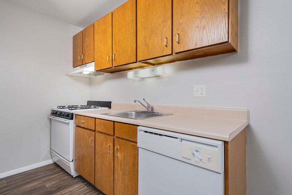 kitchen with wood cabinets and white appliances