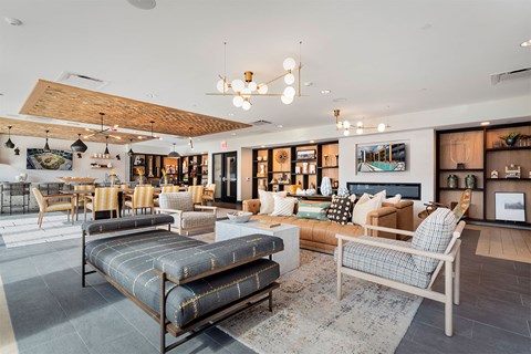 A living room with a sofa, a couch, and a chair.