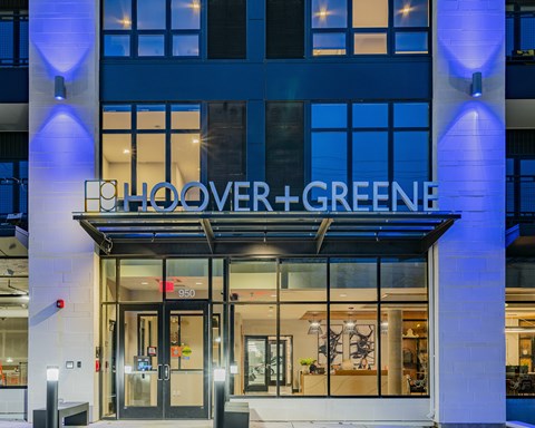 The entrance to a building with the name "EH OOVER+GREENE" on it.