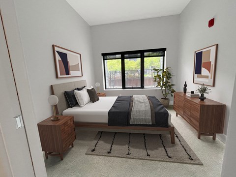 A bedroom with a bed, nightstands, and a rug.