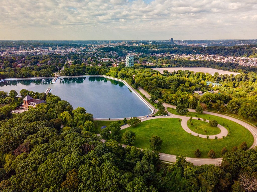 an aerial view of a park and a lake