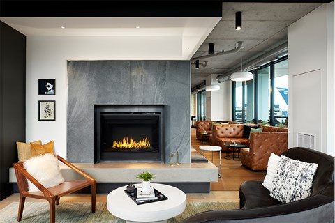 A modern living room with a fireplace and comfortable seating.